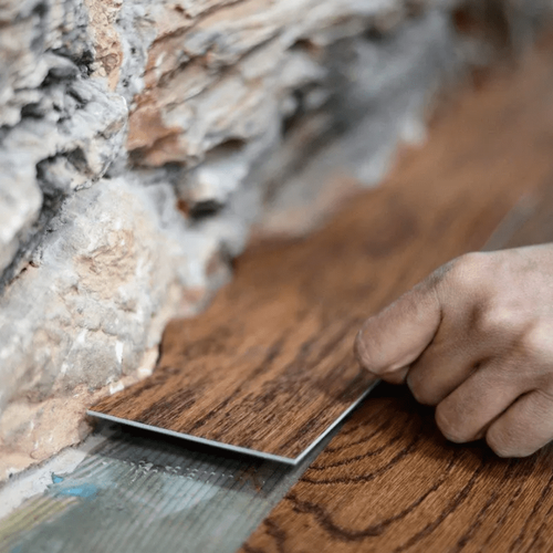 Flooring professional laying down one of the last pieces of a Yucaipa, CA installation